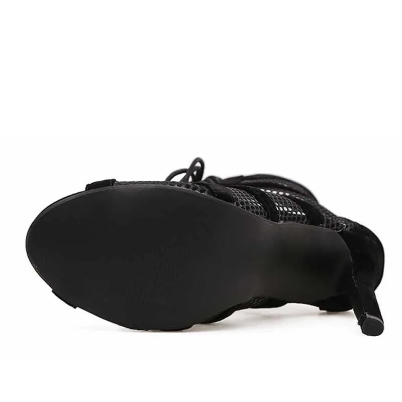 Black suede women's lace-up high heel shoes with an 11.5 cm heel on a plain background.
