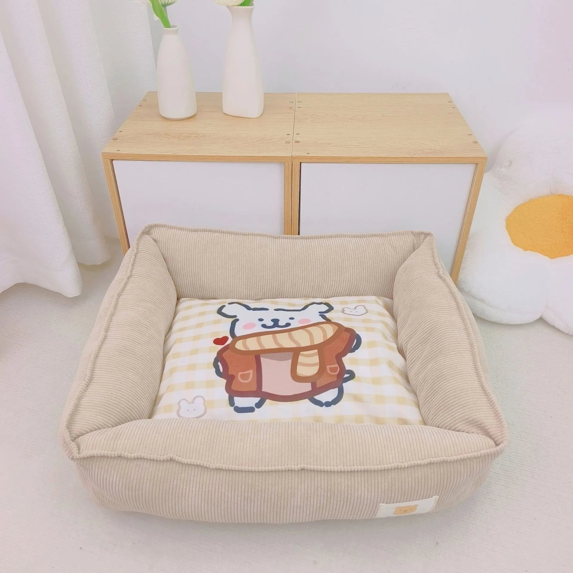 Rectangular cloth pet nest for dogs and cats in a choice of colours, shown in two available sizes.