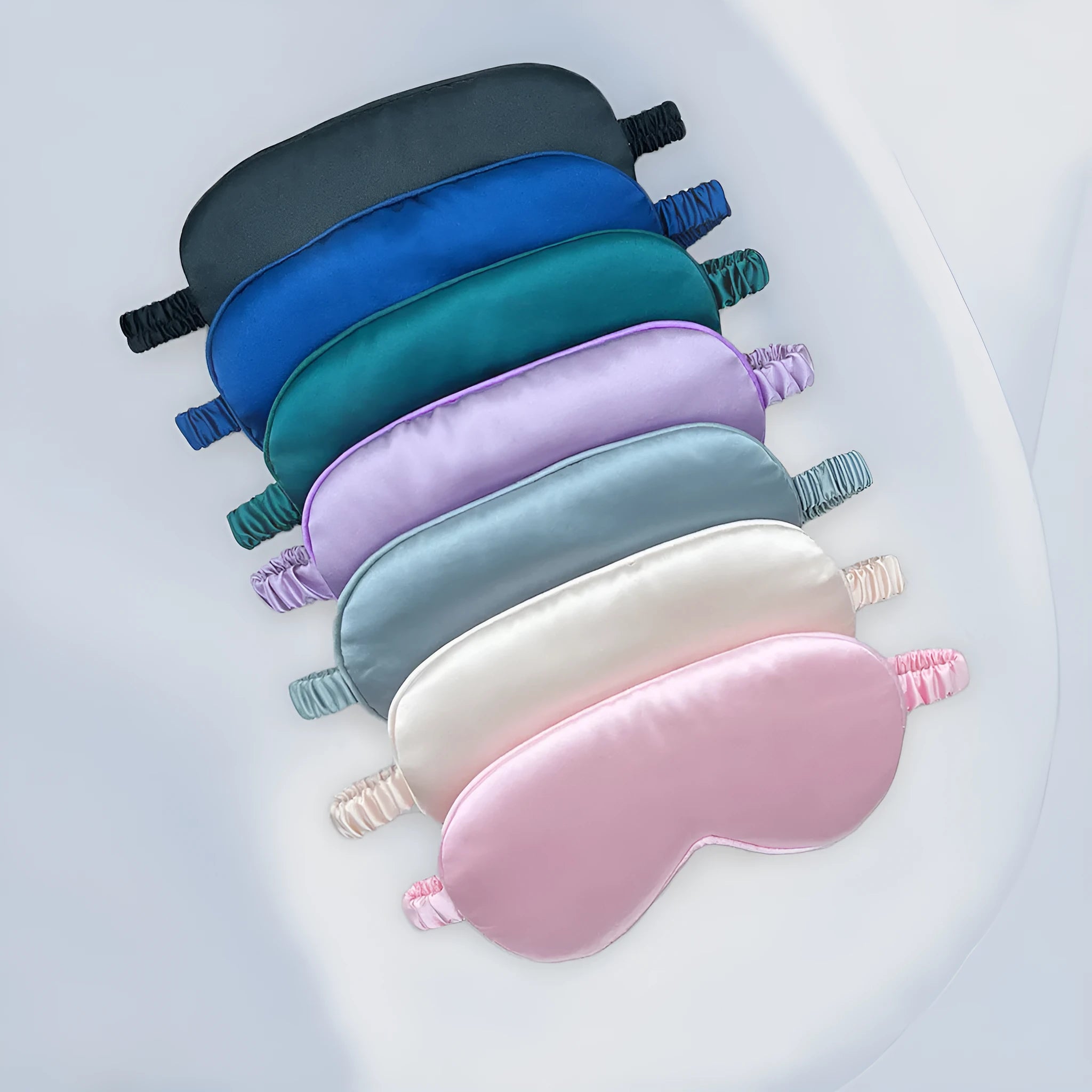 Double-sided rayon elastic satin eyeshade shown in a selection of its 17 available colours.