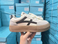 Low-top lace-up board shoes in brown or blue with patent leather-look finish and round toe
