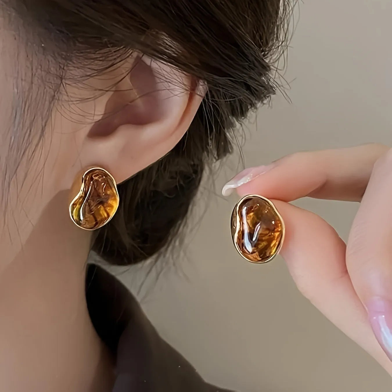 Three pairs of handmade geometric earrings with tassel details in gold electroplated finish