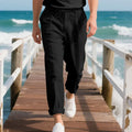 Men's casual linen trousers in a straight leg cut with a drawstring waist, shown in a light colour.