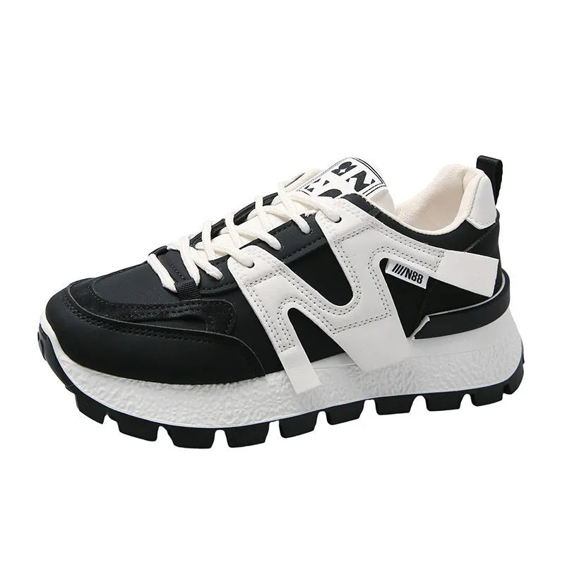 Women's white low-top running sneakers with round toe and lace-up closure on rubber sole