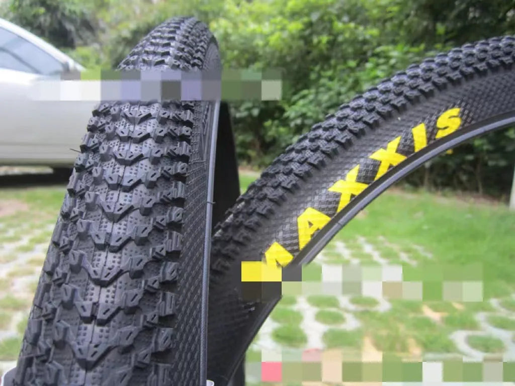 Ultralight mountain bike tyre with reinforced sidewall shown in black, suitable for 26, 27.5 or 29 inch wheels