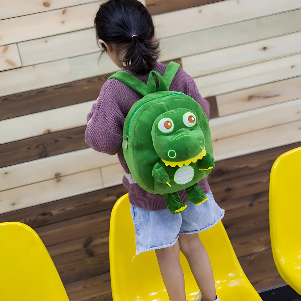 Soft plush dinosaur backpack for children with embroidery detailing and soft handle