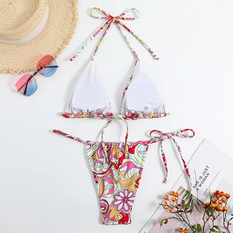 Women's triangle bikini with multicolour print and hanging neck design in separate swimwear system