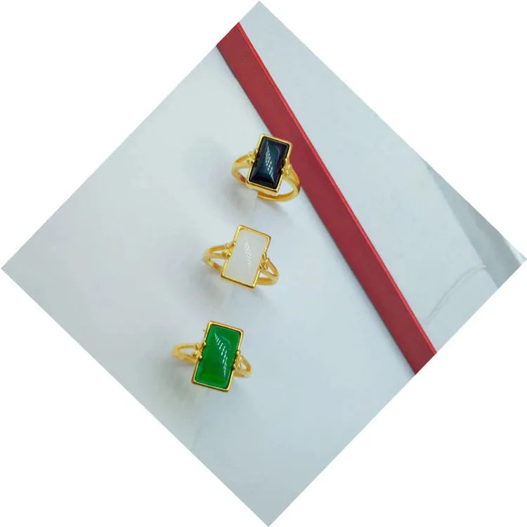 Adjustable brass gold-plated ring with electroplated gemstone in black, green or white options