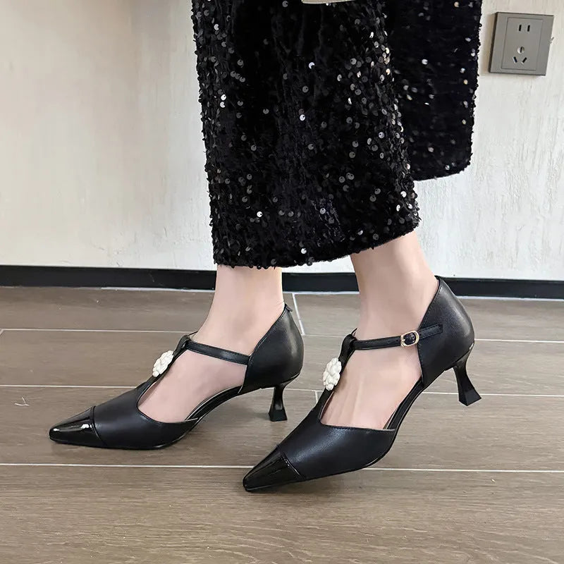 Women's flower decorated stiletto heels with pointed toe and open mouth design in black, gold and white