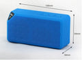 Cannon X3 small cube-shaped wireless Bluetooth portable speaker in red colour on a table