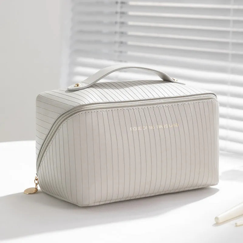 Vertical pattern pillow makeup bag in cubic shape with PU material, measuring 22.5cm height