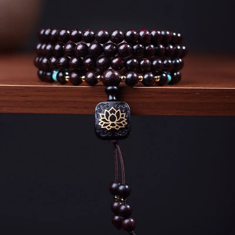 Zambia rosewood bead bracelet with flat lotus pendant showing 108 wooden beads