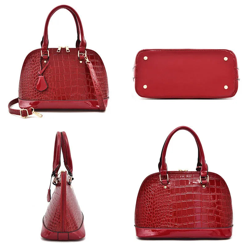 Shiny PU leather crossbody bag in shell shape design showing black, red and brown colour options