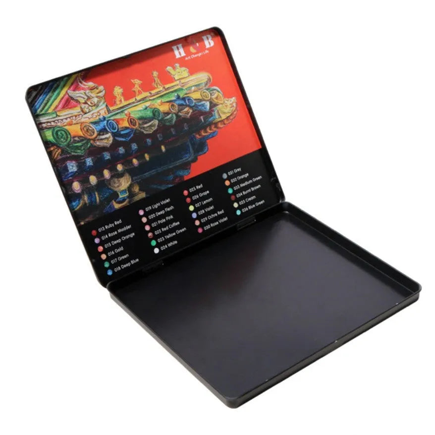 Box of 24 water soluble coloured pencils open inside a silver iron storage tin.