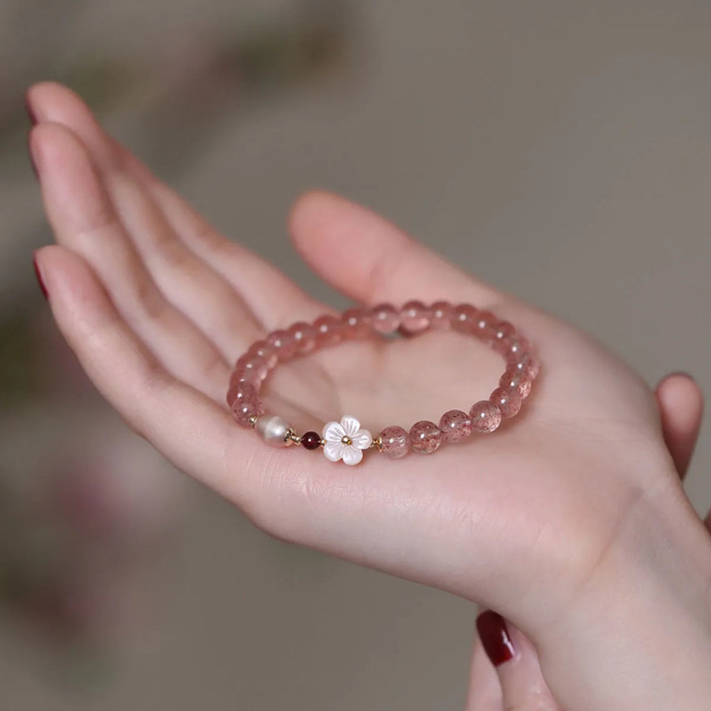 Crystal floral bracelet with strawberry quartz peach blossom colour on wrist