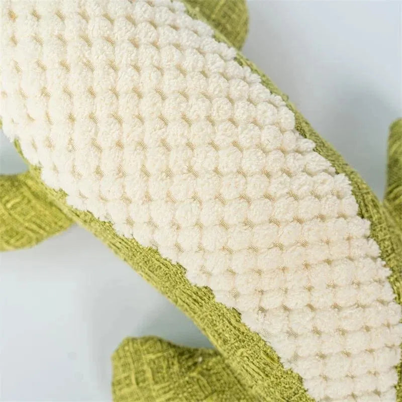 Blue, green, and red plush pet toys with a corn grid texture for chewing