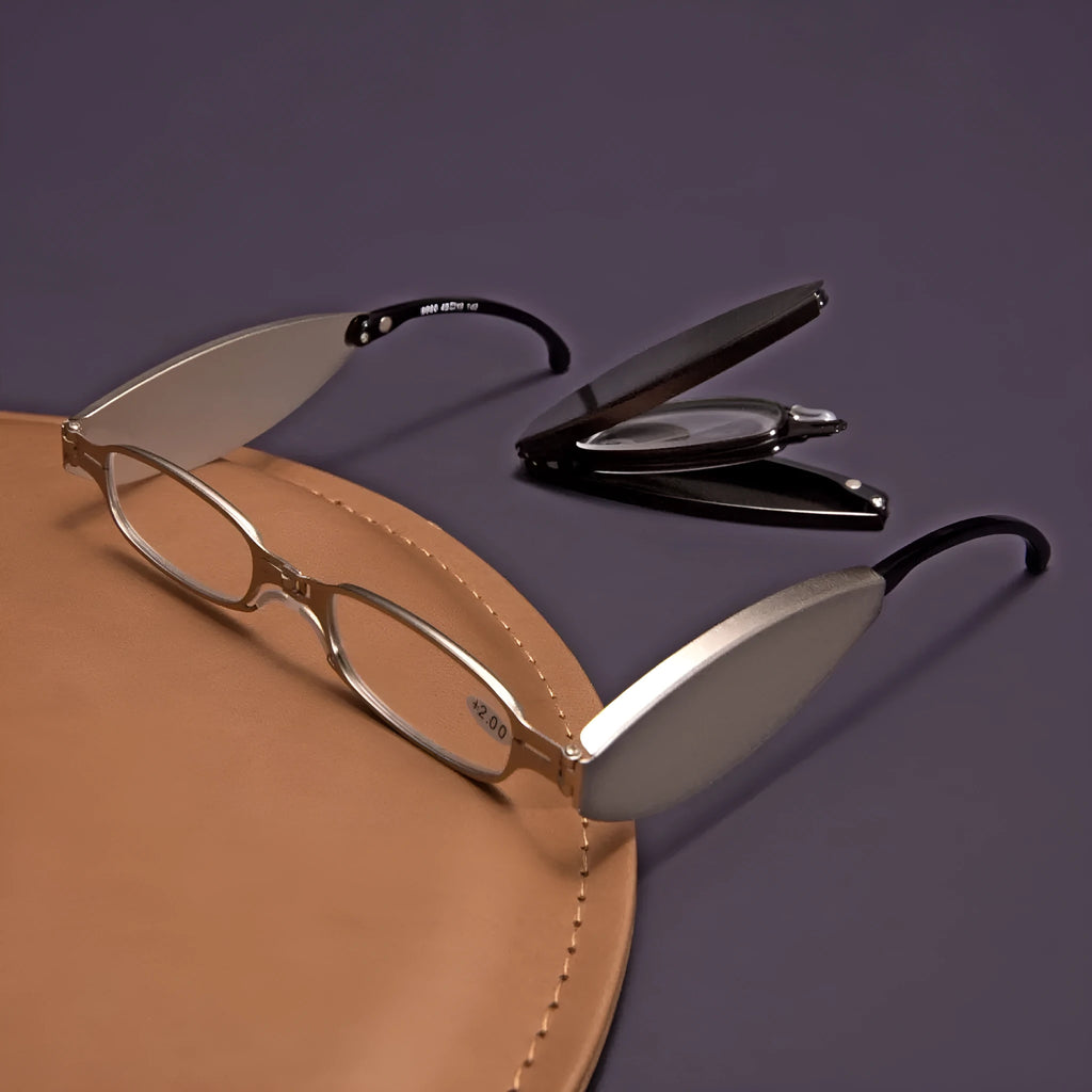 Folding presbyopic glasses in black retro frame showing ring detail and folded position