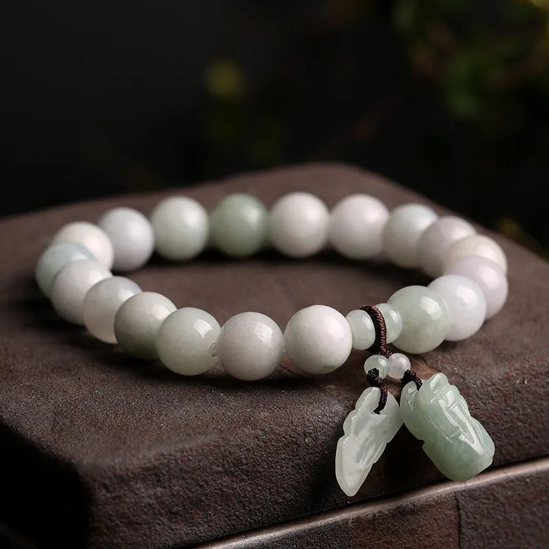 Natural jade bracelet with geometric pendant and hanging charms including Maitreya Buddha, gourd, and double apple designs