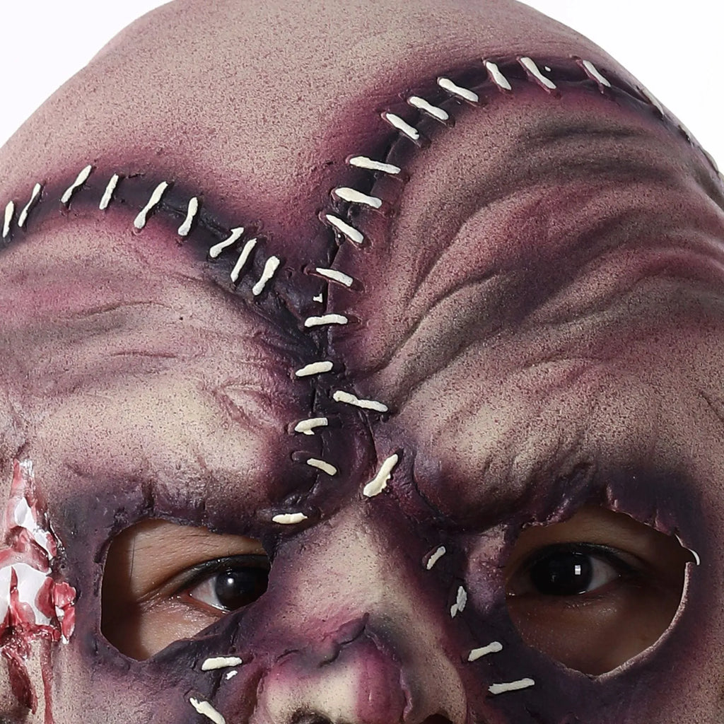 Three-sided grimace horror mask showing realistic facial texture made from natural latex
