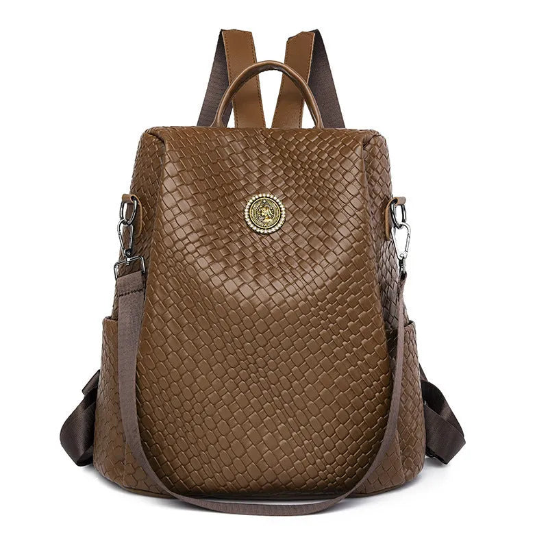 Women's black waterproof anti-theft backpack showing organisational interior compartments