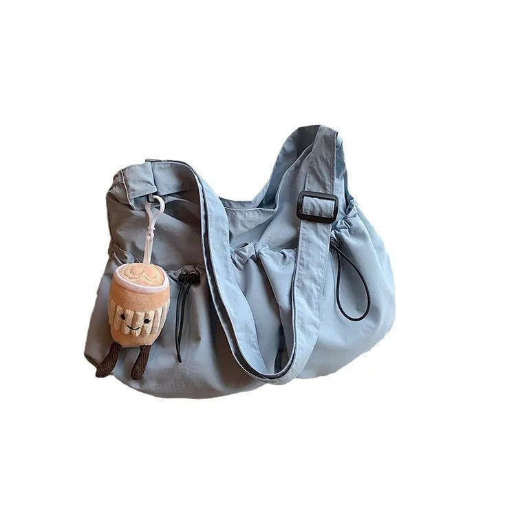 Ultra-light pleated crossbody student bag in soft polyester with split pockets