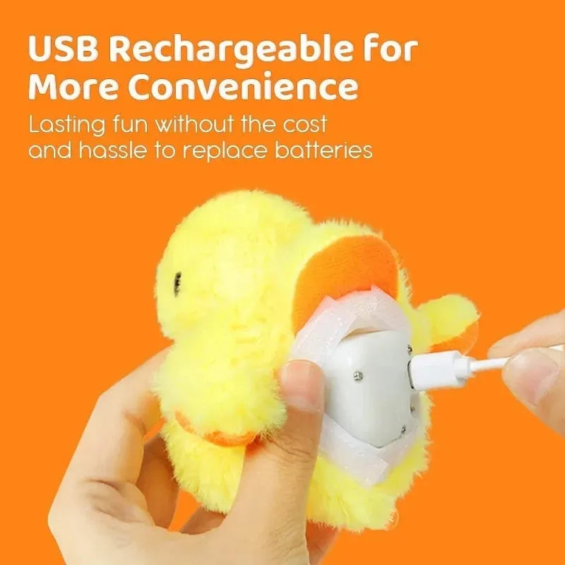 Yellow flapping duck cat plush toy with vibration sensor and USB charging cable on a neutral background.
