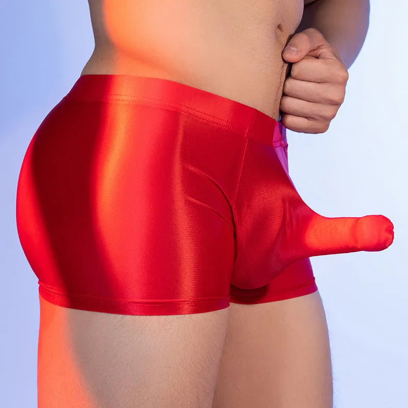 Red men's boxer shorts with elephant nose animal year design, showing mid-waist and seamless construction.