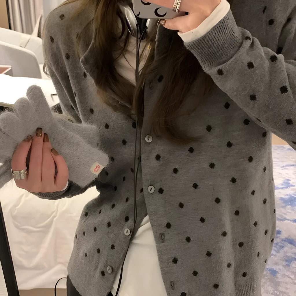 Women's grey dot knitted cardigan with long sleeves and crocheted flower detail