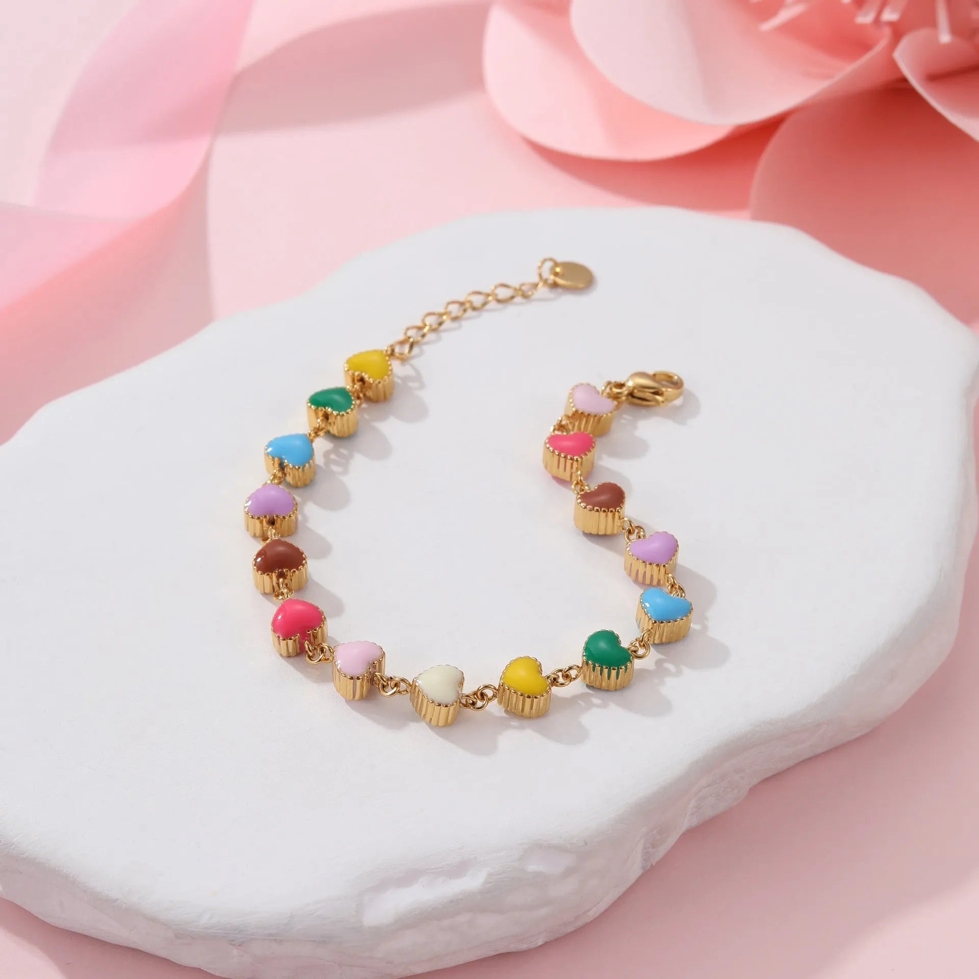 Women's stainless steel bracelet with love heart pendant featuring colourful oil finish in gold or steel colour