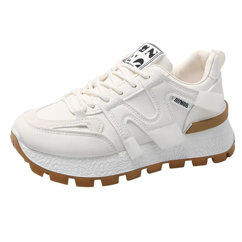 Women's white low-top running sneakers with round toe and lace-up closure on rubber sole