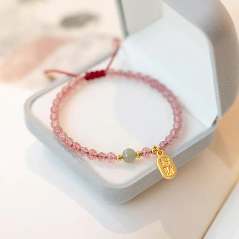 Hand-woven red rope bracelet with strawberry quartz and garnet beads in national tide style