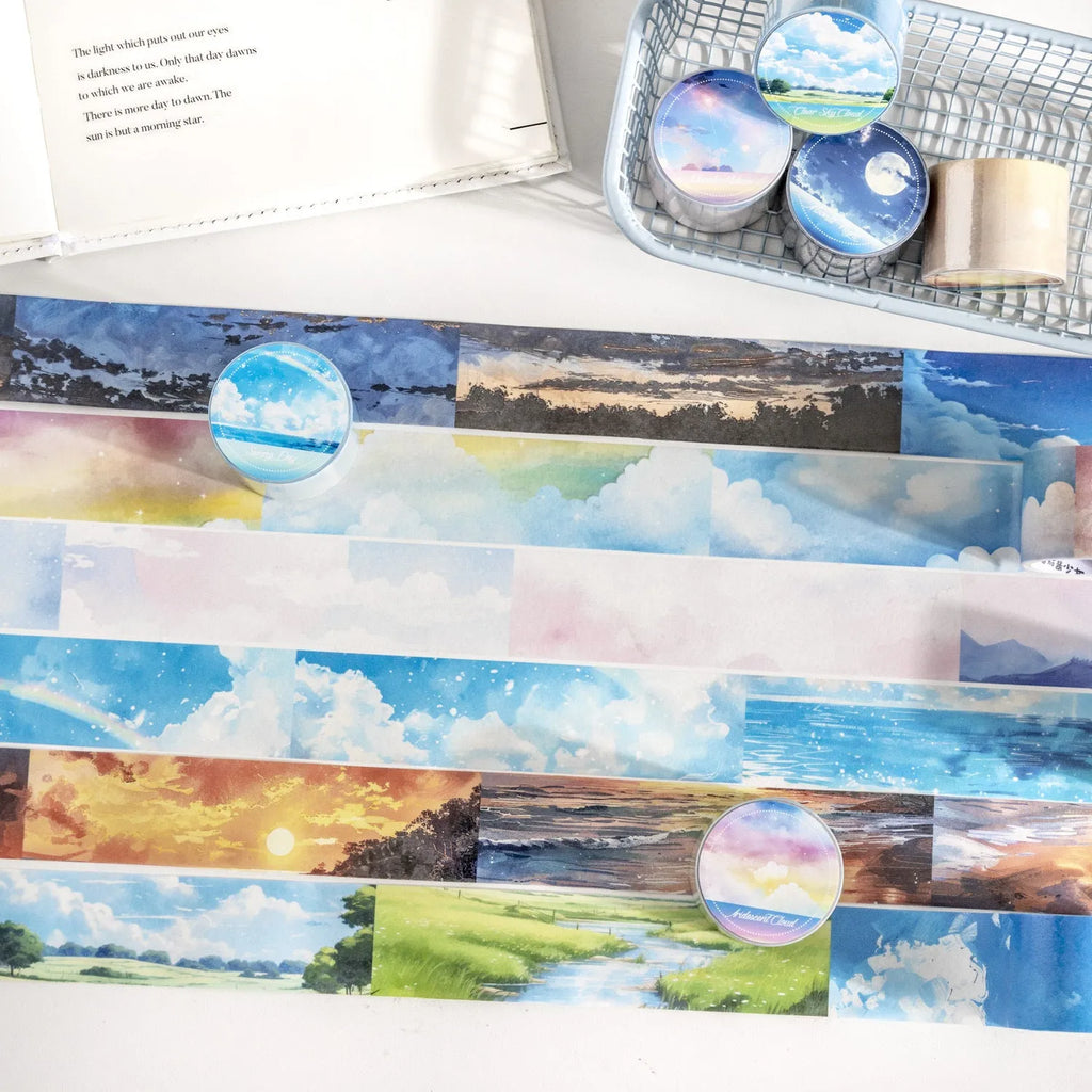 Japanese paper washi tape roll with sky theme designs including clouds, sun, twilight, moon, and nebula