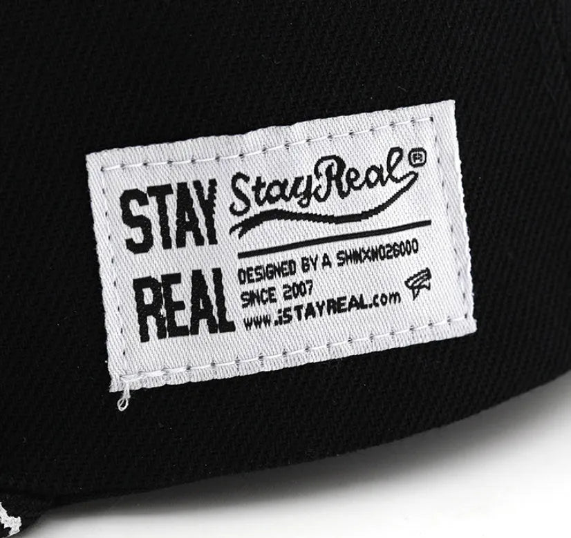 Cotton embroidered baseball cap with adjustable strap in black or white colours
