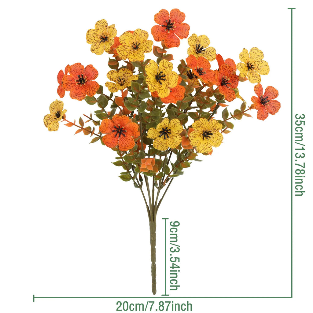 Artificial flower bouquet in autumn orange, red, and yellow colours for home or wedding decoration.