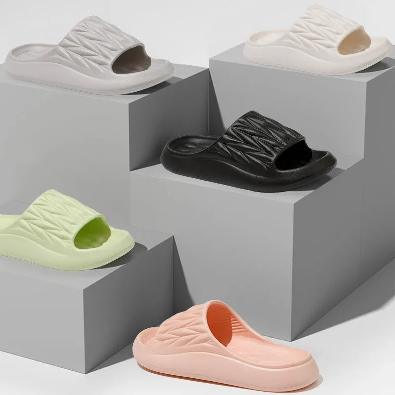 Leaf texture design EVA slippers for men and women in assorted colours on a white background.