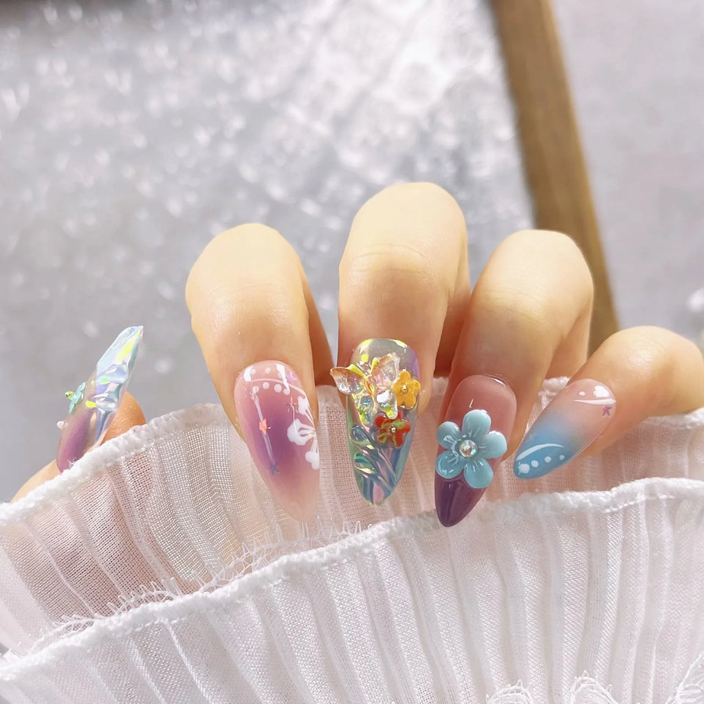 Handmade sculpture manicure set with colourful embossed flower and butterfly patterns on almond shaped nails