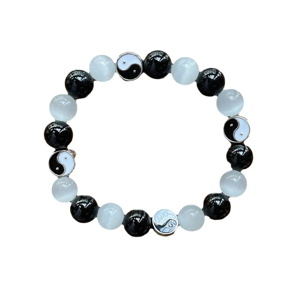 Natural stone Tai Chi bracelet with 10mm polished opal and black agate beads in traditional Chinese beaded design