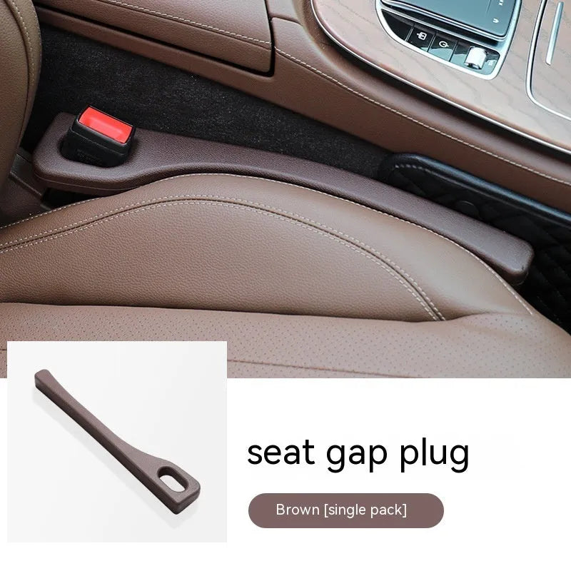 Polyurethane car seat gap filler strip in beige colour, placed between a car seat and centre console.