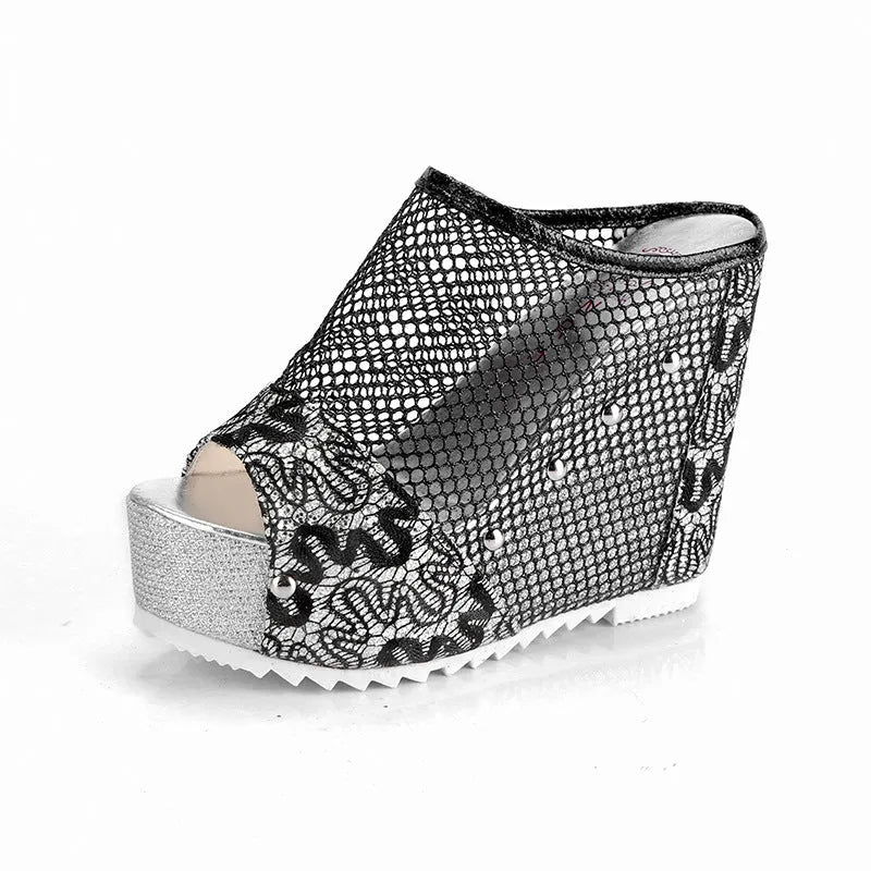 Women's black platform sandals with a lace-up ankle strap and hollowed-out chunky heel.