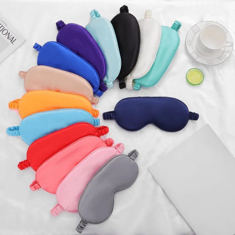 Double-sided rayon elastic satin eyeshade shown in a selection of its 17 available colours.