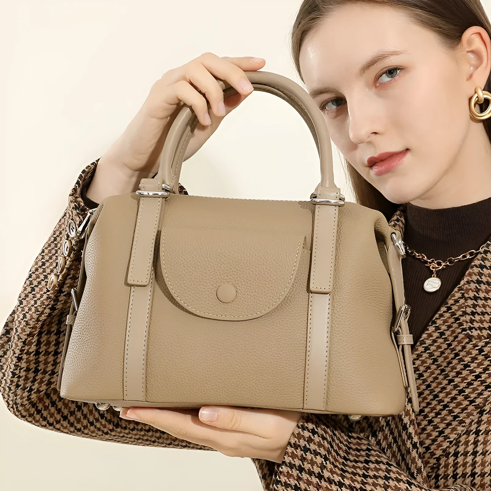 Genuine leather street style handbag for women with adjustable shoulder strap.