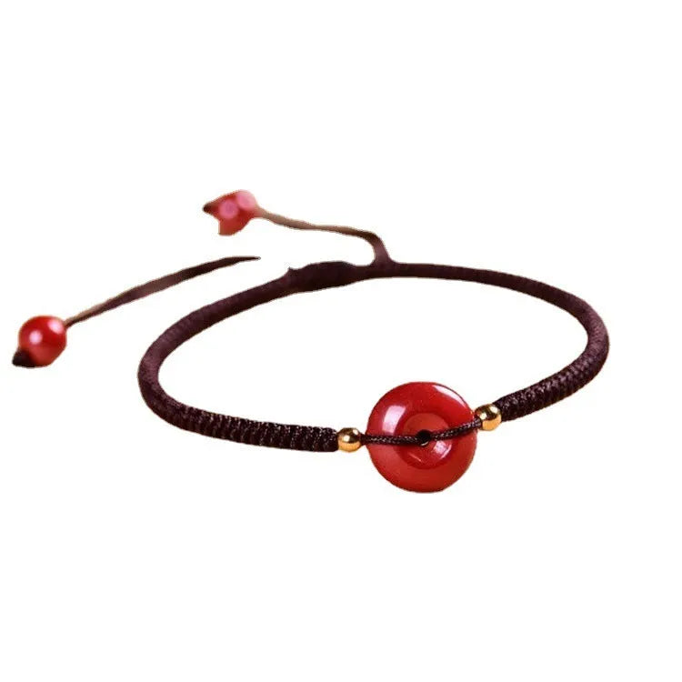 Cinnabar safety buckle bracelet with heart-shaped charm on rope cord