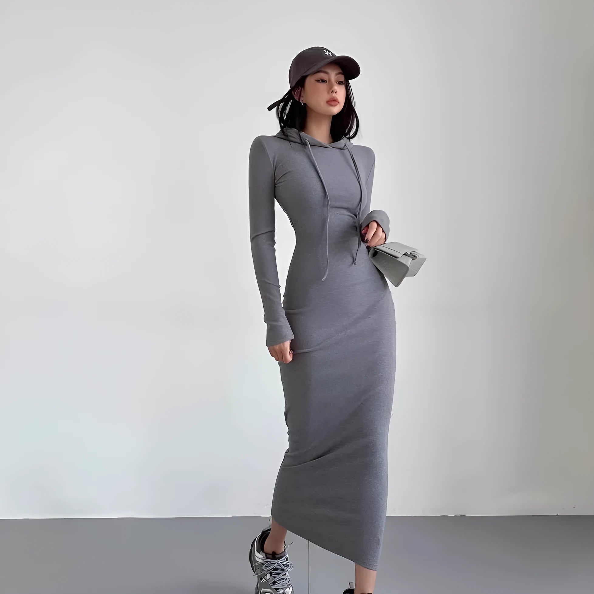 Women's long sleeve hooded sheath dress in polyester, shown in a neutral colour on a model.