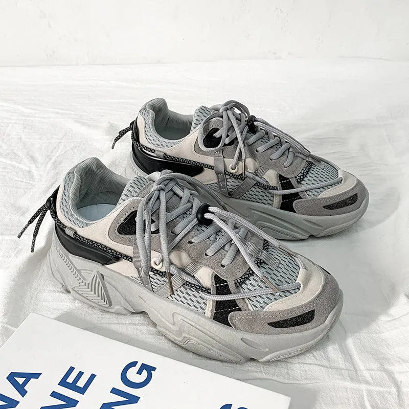 Men's white platform sneakers with lace-up front, shown on a neutral background.