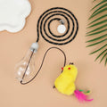 Retractable cat teaser toy hanging on door frame with dangling mouse toy and treat reward bulb