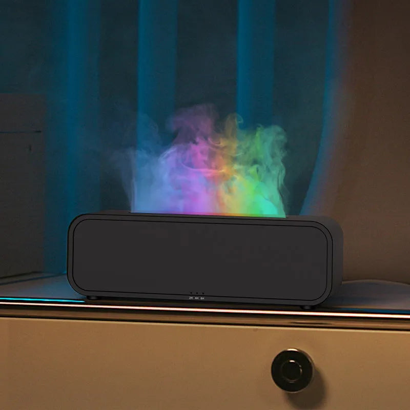 Black and white aroma diffuser with colour-changing LEDs, remote control, and USB cable.