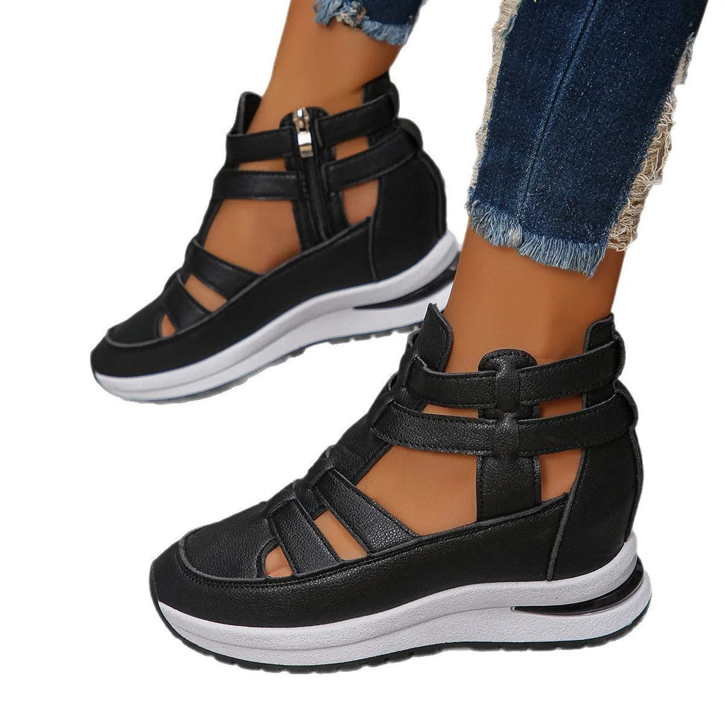 Women's black hollow-out platform sandals with round toe and Velcro strap fastening.