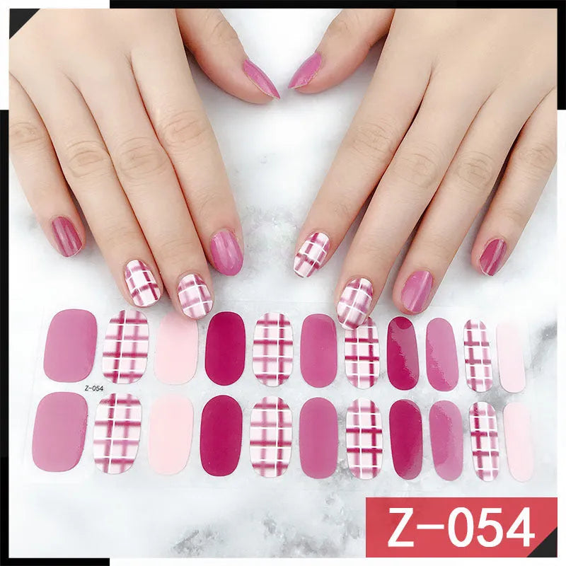 Pack of Korean nail stickers showing cartoon, strawberry, flower, and peach designs with a nail file.
