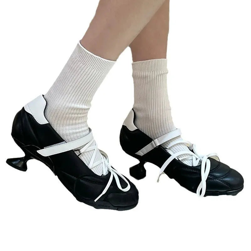 Women's silver lace-up bow sports shoes with round toe and low-top design on a white background.