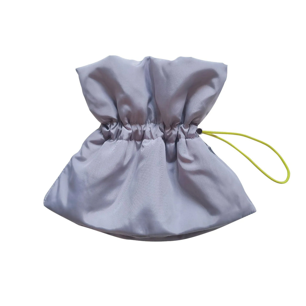 Soft blue adjustable Elizabethan recovery collar on small cat showing elastic buckle and protective cone shape