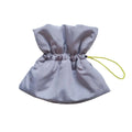 Soft blue adjustable Elizabethan recovery collar on small cat showing elastic buckle and protective cone shape